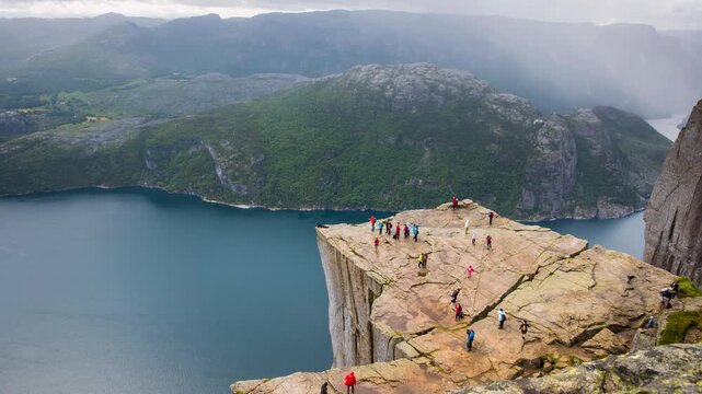 Time-lapse of hikers moving around on Preikestolen in Norway