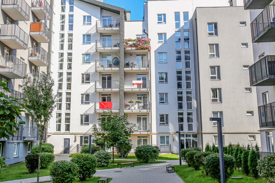 Modern Apartment Building Courtyard With Green Landscaping and Balconies
