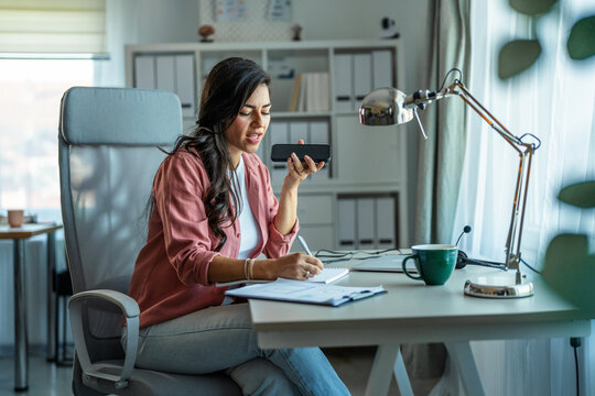 Woman multitasking working from home office