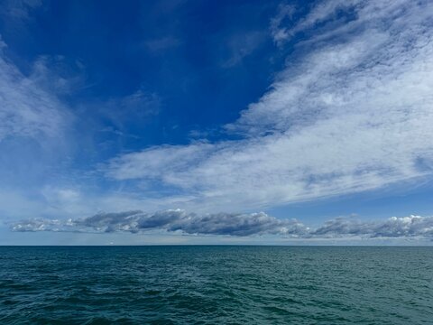 Dramatic sky clouds over ocean 