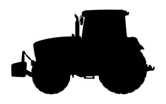 Silhouette of a farm tractor