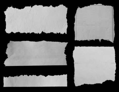 Torn papers on black
