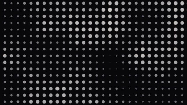 Halftone dot gradient seamless loop, dots growing and shrinking in a print style background