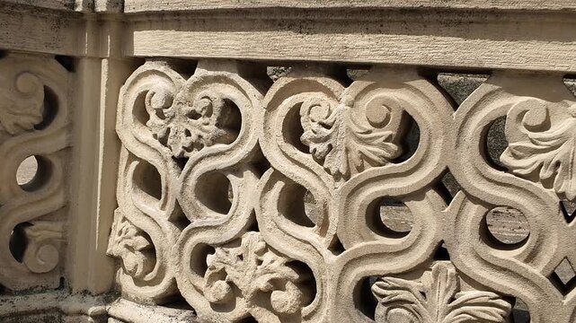 Intricate stone balustrade with ornate carvings and architectural details