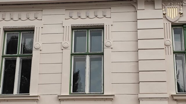 Architectural details of old European buildings with ornate window frames