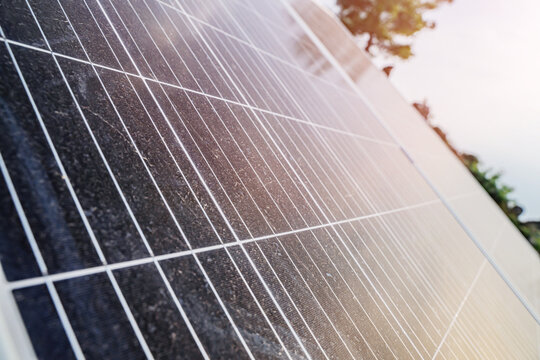 Close-up of solar panel surface texture with sunlight reflection renewable green energy concept