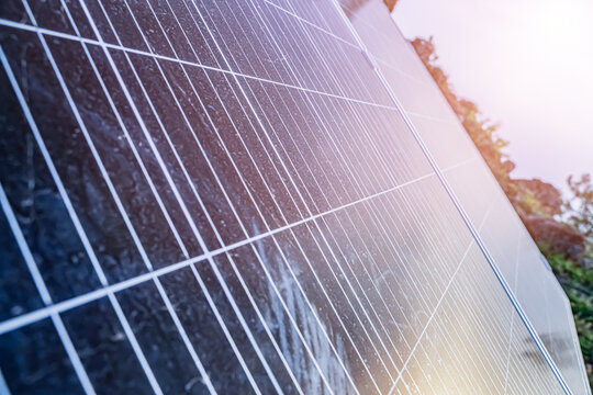 Close-up of solar panel surface texture with sunlight reflection renewable green energy concept