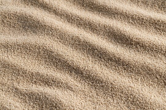 Natural Sand Waves Textured Background with Diagonal Ripples and Shadows