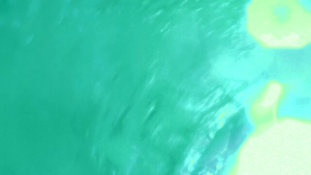 Abstract underwater shot of swirling ocean water with flowing blue currents and natural marine motion.