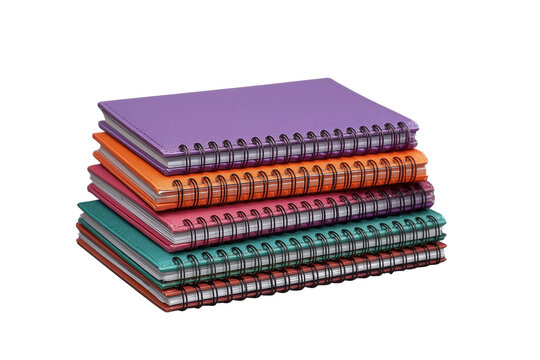 Wide pile of multicolor spiral bound notebooks