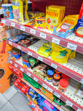 San luis potosi, mexico, 04 15 2026, oxxo shelves loaded with multiple food items and daily essentials in a retail environment