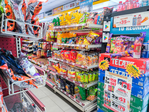 San luis potosi, mexico, 04 15 2026, oxxo supermarket aisle featuring packed potato chips, other snacks and beer for sale
