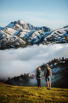 Couple man and woman travel in Georgia family hiking explore Caucasus mountains together, romantic active summer vacations tour adventure lifestyle - friends enjoying Gomis Mta view discover Guria