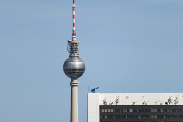 Berlin, Germany - April 23, 2026: The Fernsehturm television tower rises above central Berlin with the Park Inn by Radisson hotel and the Berlin Cathedral seen from the Reichstag rooftop. © Andrei Antipov