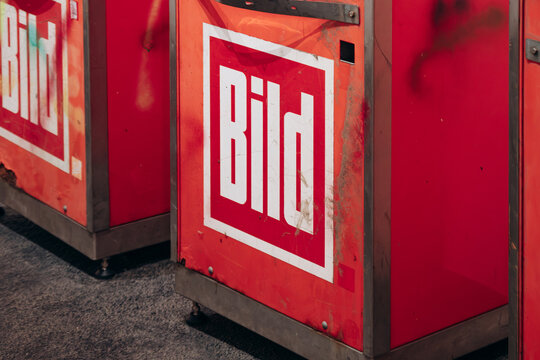 Berlin, Germany - April 23, 2026: Branded recycling bins inside Urban Nation Museum featuring artwork by Shepard Fairey.