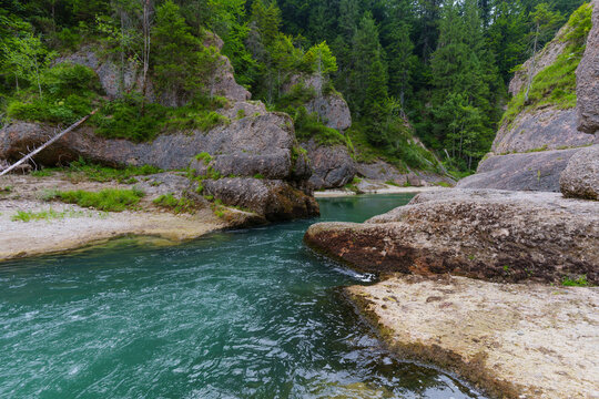 Scenic Turquoise Waters Flowing Through Rocky Cliffs of Ammer Gorge
