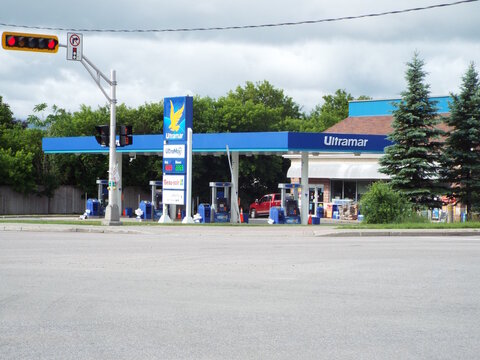 Gatineau, Quebec, Canada &ndash; June 13, 2026: An "Ultramar gas station" features a blue canopy, fuel pumps, a price sign, and a Beau-soir convenience store under cloudy skies at 267  R.Front.
