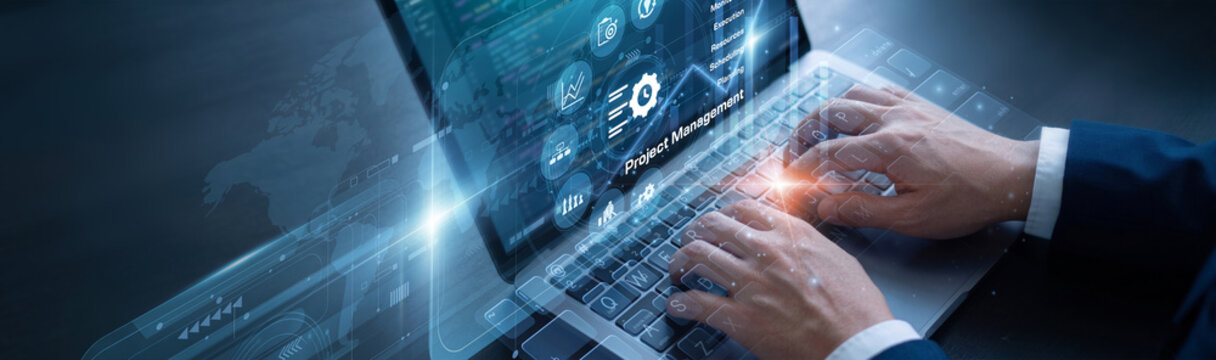 Project manager is diligently managing key timelines using laptop for the Project Management network protocols to ensure absolute data clarity. They are actively building a firm framework.