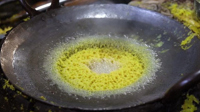 Ghewar making process in a sweet shop
