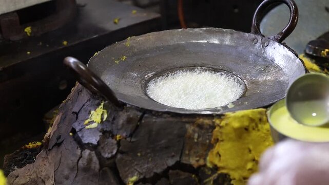Ghewar making process in a sweet shop