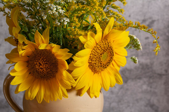 Rustic Sunflower Bouquet with Goldenrod, Yarrow and Apricots on Wooden Table