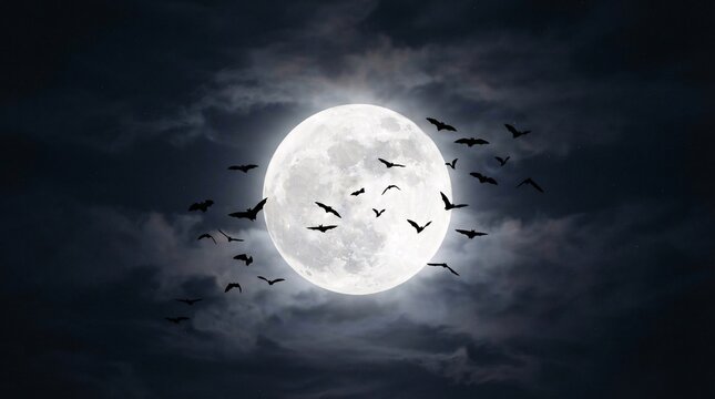 A swarm of dark bats flying in front of a bright full moon set against a dramatic night sky filled with