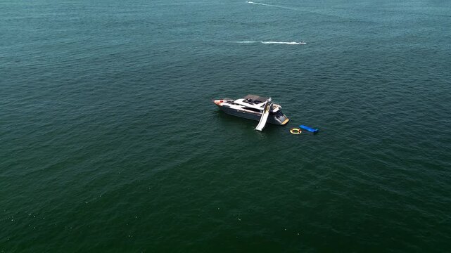 Luxury Two-Story Yacht with Inflatable Slide Anchored Off Pristine Animas Beach Resort Destination