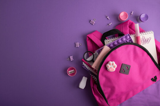 Pink backpack with school supplies