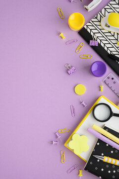 School supplies and stationery on purple background