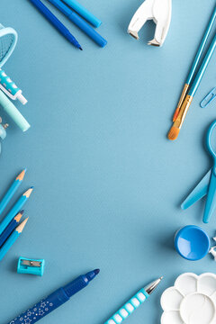 Blue stationery arranged on a blue background