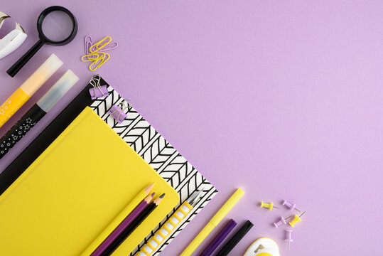 School supplies and stationery on a purple background