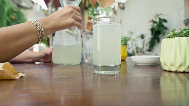 Fresh lemonade blending with bubbles and foam.