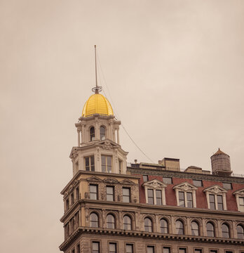 Historic New York City Building with Golden Dome and Ornate Architecture