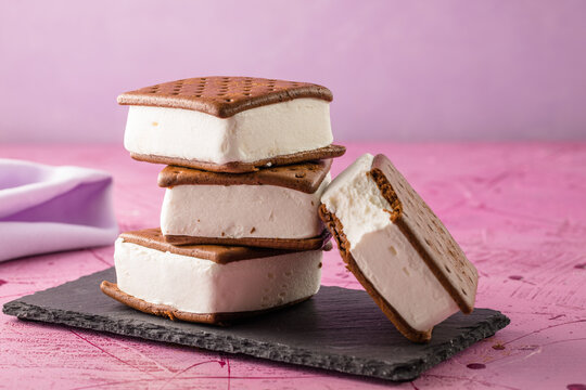 Delicious ice cream sandwiches  on pink table