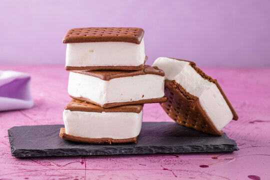 Delicious ice cream sandwiches  on pink table