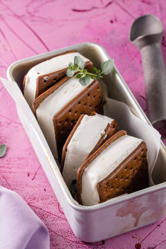Delicious ice cream sandwiches  on pink table