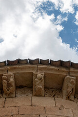 Carved stone corbels and metopes depicting human figures and geometric rosettes under the eaves at the 13th-century Romanesque Church of Natividad de Nuestra Senora in Sotillo, Segovia, spain © Nandi Estévez