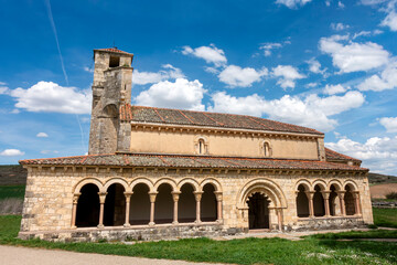 Fototapeta premium Late 12th-century Romanesque Church of Nuestra Senora de la Asuncion featuring its iconic porticoed gallery and square bell tower in Duraton, Sepulveda, Segovia, Castilla y Leon, Espana