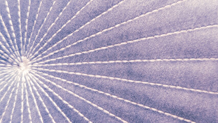 Fototapeta premium quilted purple fabric texture with radial stitching lines