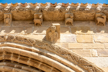 Carved stone corbels depicting human and animal figures under the eaves of the 12th century Romanesque Ermita de Santa Maria de la Antigua in Bañares, La Rioja, Espana © Nandi Estévez