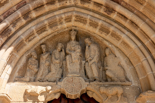 Carved Romanesque stone tympanum depicting the Adoration of the Magi and Epiphany scene on the portal of the 12th century Ermita de Santa Maria de la Antigua in Banares, La Rioja, Espana