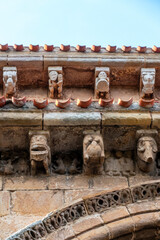 Detail of carved stone corbels and metopes above the portal archivolts of the Collegiate Church of San Pedro in Cervatos, Campoo de Enmedio, Cantabria, Spain, Romanesque architecture from the 12th © Nandi Estévez
