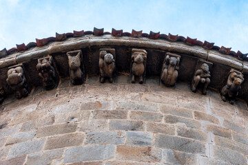 Detail of carved stone corbels under the apse eaves of the Collegiate Church of San Pedro in Cervatos, Campoo de Enmedio, Cantabria, Spain, Romanesque architecture from the 12th century © Nandi Estévez