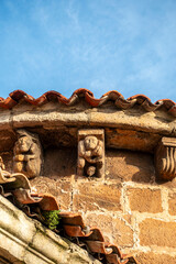 Detail of carved stone corbels under the roof eaves of the Church of San Cipriano in Bolmir, Campoo de Enmedio, Cantabria, Spain, featuring Romanesque architecture from the 12th century © Nandi Estévez