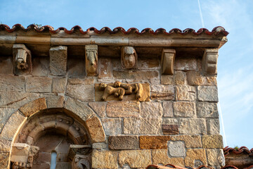 Carved stone corbels and relief detail under the roof eaves of the Church of San Cipriano in Bolmir, Campoo de Enmedio, Cantabria, Spain, Romanesque architecture from the 12th century © Nandi Estévez