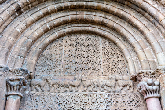 Detail of the portal tympanum and carved lintel with palmettes and animal reliefs at the Collegiate Church of San Pedro in Cervatos, Campoo de Enmedio, Cantabria, Spain, Romanesque architecture