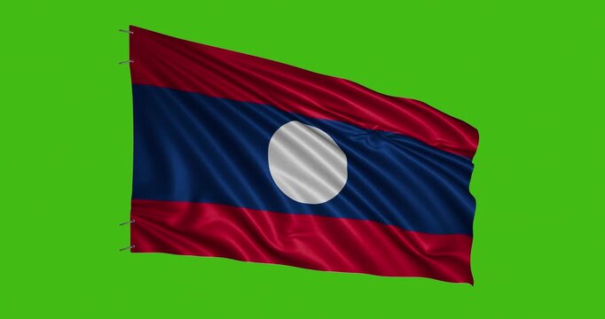 Lao flag waving on a green background during a national celebration