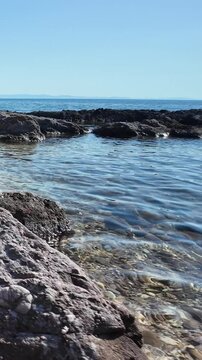 Rocky coastline and crystal clear waters on the Aegean Sea on the island of Thasos, Greece