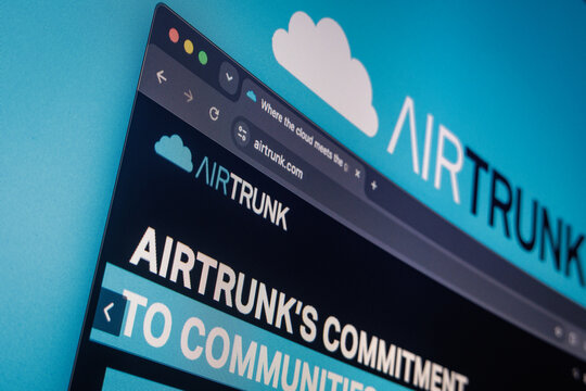 Raleigh, North Carolina - August 4, 2026: Close-up of a computer screen showing the AirTrunk website and logo in the background.