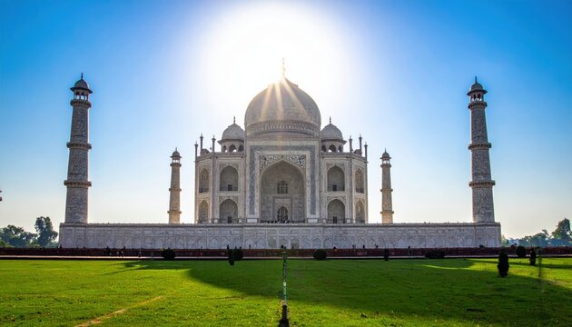 The Majestic Taj Mahal at Sunrise, an Iconic Marble Mausoleum Gleaming Under the Sun's Rays